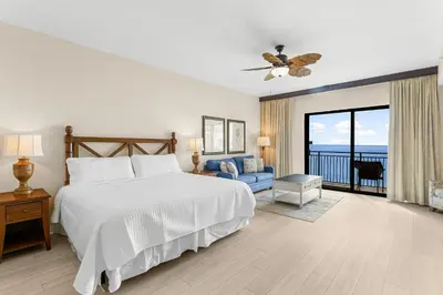 a bedroom with a bed and a view of the ocean at Origin 1220 - Studio King - Gulf View by Beach Haven Vacation Rentals in Panama City Beach