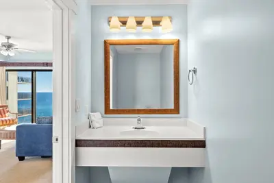 a bathroom with a sink and a mirror at Origin 1216 - One Bedroom - Breath Taking Gulf Views by Beach Haven Vacation Rentals in Panama City Beach