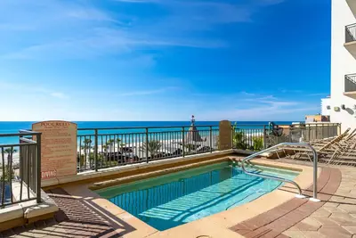 a swimming pool with a view of the ocean at Origin 1125 - Studio King - Peaceful Nature View Unit by Beach Haven Vacation Rentals in Panama City Beach