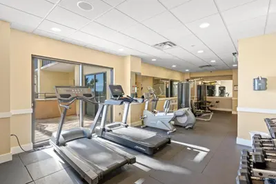 a gym with treadmills and elliptical machines at Origin 1116 - One Bedroom - Beautiful Gulf View by Beach Haven Vacation Rentals in Panama City Beach