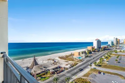 a view of the beach and the ocean from a balcony at Origin 1107- One Bedroom - Gorgeous Gulf & Sunset Views by Beach Haven Vacation Rentals in Panama City Beach