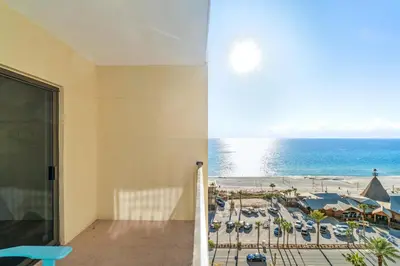 a room with a view of the beach and the ocean at Origin 1032 - One Bedroom - Pool and Gulf Views by Beach Haven Vacation Rentals in Panama City Beach