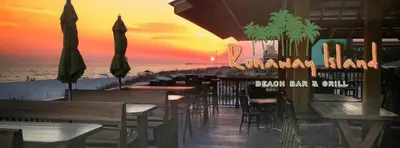 a beach bar and grill with tables and umbrellas at Origin 0915 - Studio King - Cozy Nature View by Beach Haven Vacation Rentals in Panama City Beach
