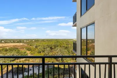 a view from the balcony of a building at Origin 0815 - Studio King - Peaceful Nature View by Beach Haven Vacation Rentals in Panama City Beach