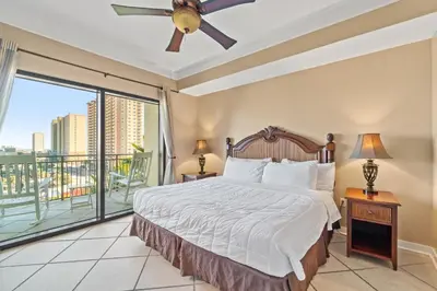 a bedroom with a bed and a large window at Origin 0731- One Bedroom - Sunny Gulf Views by Beach Haven Vacation Rentals in Panama City Beach