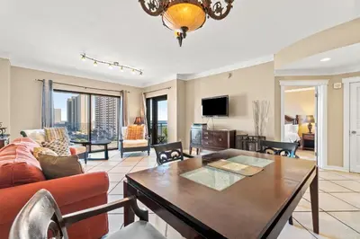 a living room with a couch and a table at Origin 0731- One Bedroom - Sunny Gulf Views by Beach Haven Vacation Rentals in Panama City Beach