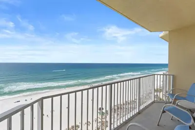 a balcony with chairs and a view of the beach at Boardwalk Beach Resort #1107 by Book That Condo in Panama City Beach