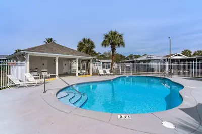 a swimming pool in the middle of a yard at The Love Shack (2/2) in Panama City Beach