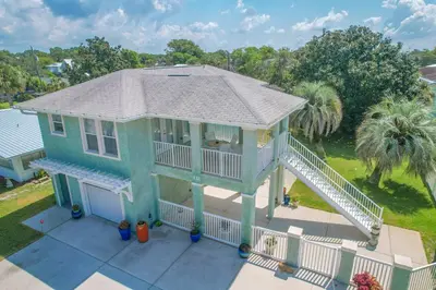 an aerial view of a house with a deck at New! Iguana Palms - Private beach - Pet Freindly! in Panama City Beach