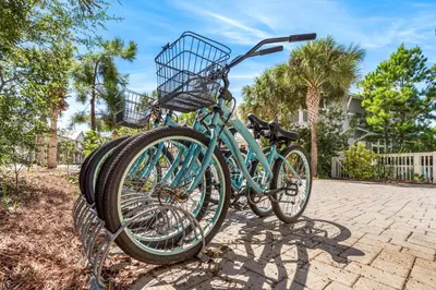 a blue bike is parked on a sidewalk at Amaryllis Point - 30A, Private Pool, Bicycles, 3 King Masters! in Rosemary Beach