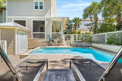 a swimming pool in front of a house at Amaryllis Point - 30A, Private Pool, Bicycles, 3 King Masters! in Rosemary Beach