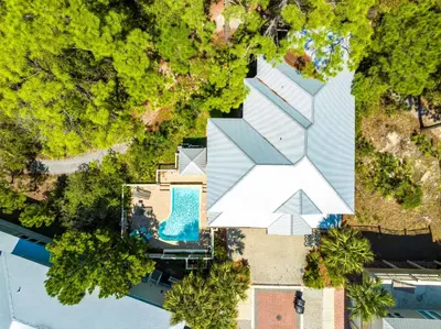 an overhead view of a house with a swimming pool and trees at Amaryllis Point - 30A, Private Pool, Bicycles, 3 King Masters! in Rosemary Beach