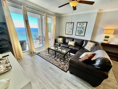 a living room with a couch and a table at Ocean Reef 1607 in Panama City Beach