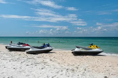 a row of motorcycles parked on the beach at Calypso 1-1709 by Emerald Coast Retreats in Panama City Beach