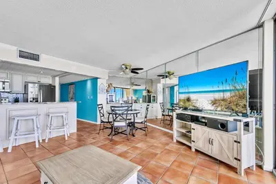 a kitchen and dining room with a view of the beach at Edgewater Tower 1-608 in Panama City Beach