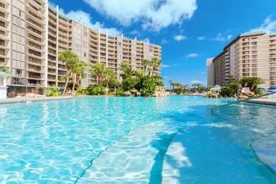 a large swimming pool in front of some buildings at Edgewater Tower 1-608 in Panama City Beach