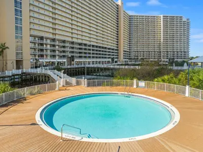 a large swimming pool in front of a large building at Laketown Wharf #236 by Nautical Properties in Panama City Beach