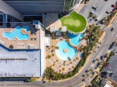 an overhead view of a pool at a resort at Laketown Wharf #236 by Nautical Properties in Panama City Beach