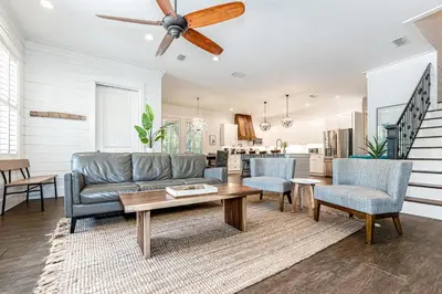 a living room with a couch and a table at 9 E Willow Mist in Preserve at Inlet Beach in Inlet Beach