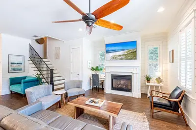 a living room with a couch and a fireplace at 9 E Willow Mist in Preserve at Inlet Beach in Inlet Beach
