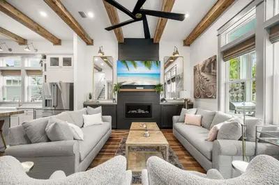 a living room with a couch and a fireplace at Blue Porch Paradise in Inlet Beach