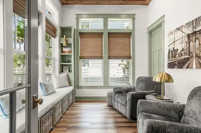 a living room with two chairs and a couch at Blue Porch Paradise in Inlet Beach