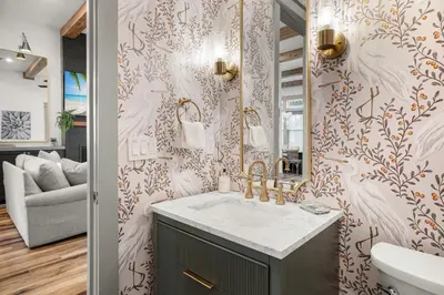 a bathroom with a sink and a mirror at Blue Porch Paradise in Inlet Beach