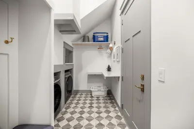 a small laundry room with a washer and dryer at Blue Porch Paradise in Inlet Beach