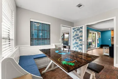 a dining room with a table with a fish on it at Caribbean feel,Mini&Disc Golf,Heated Pool,Game Rom in Panama City Beach