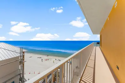 a balcony with a view of the beach at Treasure Island #0401 in Panama City Beach