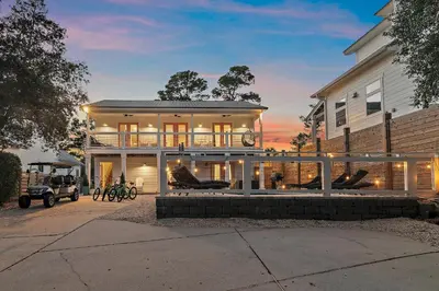 a large white house with at Beach & Bubbles in Santa Rosa Beach