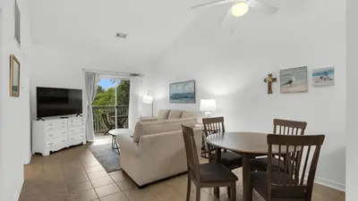 a living room with a couch and a table at Heron's Watch 6207 in Santa Rosa Beach