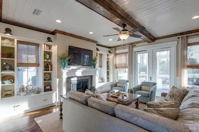 a living room with a couch and a fireplace at Gram's Beach Spot in Santa Rosa Beach