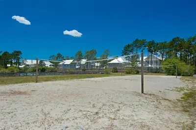 a volley ball hoop on a sandy beach at Gram's Beach Spot in Santa Rosa Beach