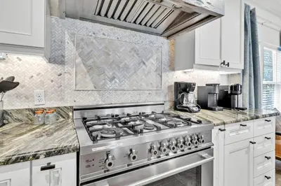 a kitchen with a stainless steel stove top oven at Saltaire-2 in Santa Rosa Beach
