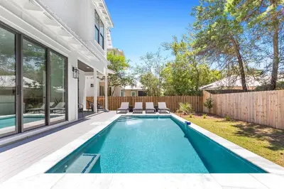a swimming pool in the backyard of a house at Casa Al Mare in Santa Rosa Beach