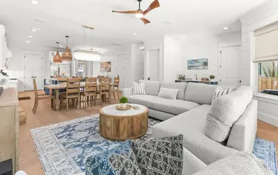 a living room with a couch and a table at Casa Al Mare in Santa Rosa Beach