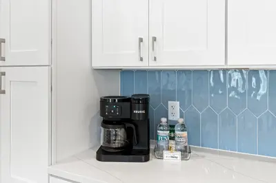 a coffee maker on a shelf in a kitchen at Above It All in Inlet Beach