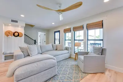 a living room with two couches and a ceiling fan at Walk to Laguna Beach PCB Home with Pool Near Gulf! in Panama City Beach