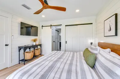 a bedroom with a bed and a ceiling fan at Walk to Laguna Beach PCB Home with Pool Near Gulf! in Panama City Beach