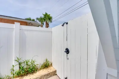 a white fence next to a white gate at Walk to Laguna Beach PCB Home with Pool Near Gulf! in Panama City Beach