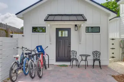 a group of bikes parked in front of a house at Walk to Laguna Beach Modern Studio in PCB! in Panama City Beach