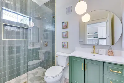 a bathroom with a toilet and a sink and a shower at Walk to Laguna Beach Modern Studio in PCB! in Panama City Beach