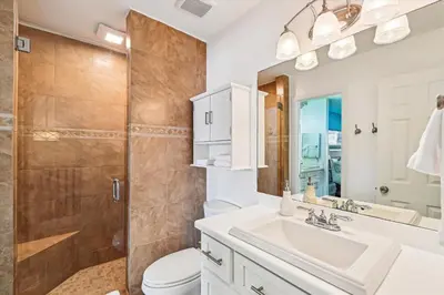 a bathroom with a sink toilet and a shower at Beachwalk 17B home in Panama City Beach