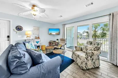 a living room with a couch and two chairs at Beachside Villas 1022 in Santa Rosa Beach