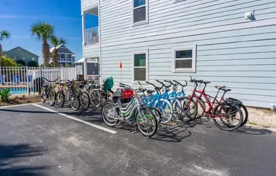 a group of bikes parked next to a building at Beachside Villas 1022 in Santa Rosa Beach