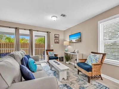 a living room with a couch and chairs at Beachside Villas 1211 in Santa Rosa Beach