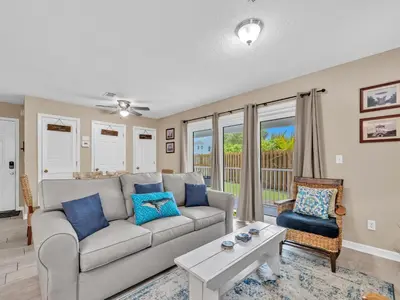 a living room with a couch and a table at Beachside Villas 1211 in Santa Rosa Beach