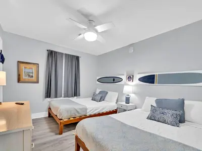 a hotel room with two beds and a ceiling fan at Beachside Villas 1131 in Santa Rosa Beach