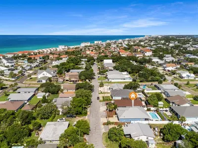 an aerial view of a small town with houses and the ocean at Beach House - Lazee Daze by Panhandle Getaways in Panama City Beach